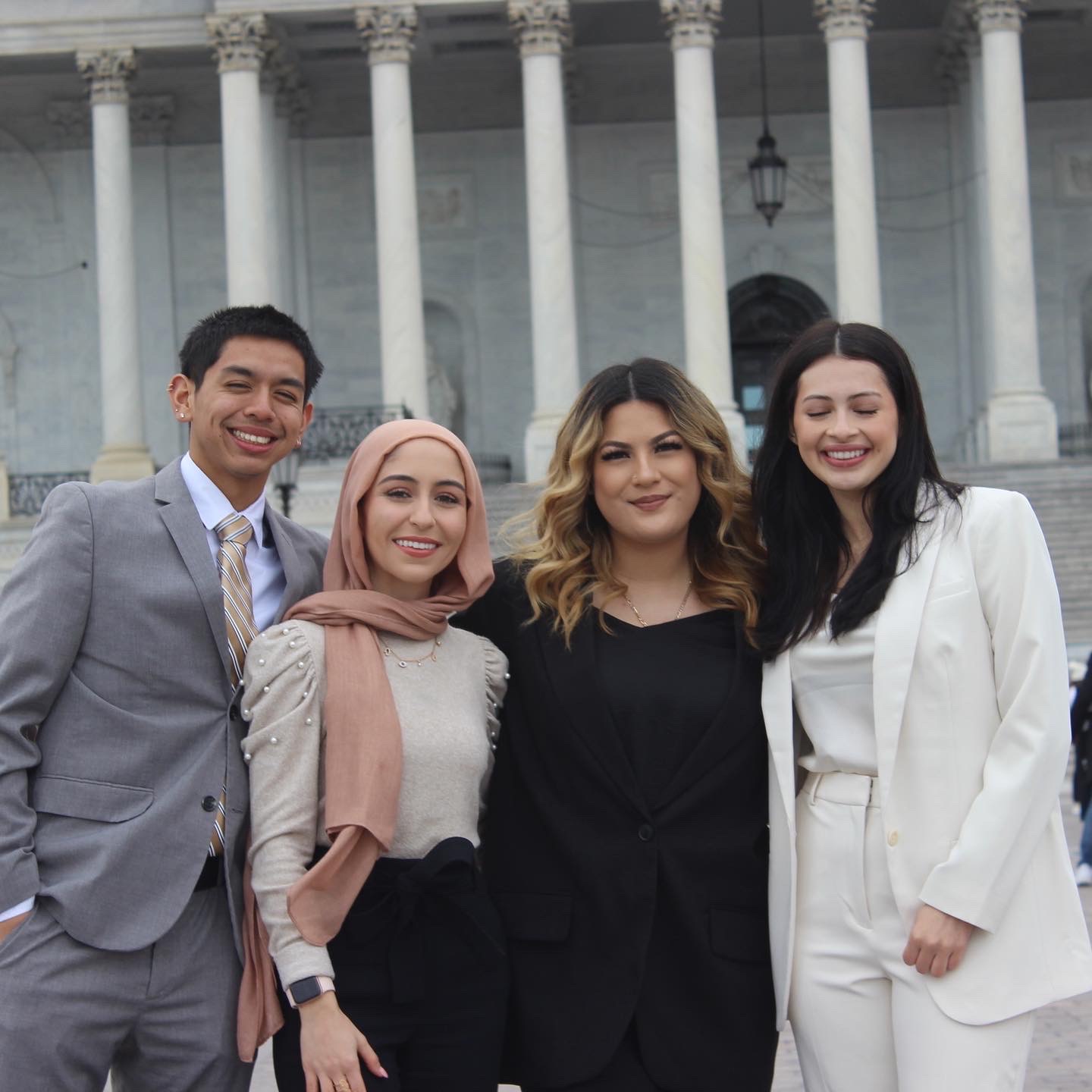 Jordan Guillen standing to the far left with three other friends in front of the Capitol building