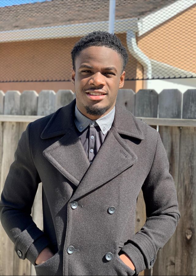 Program alumni David standing outside wearing a winter coat