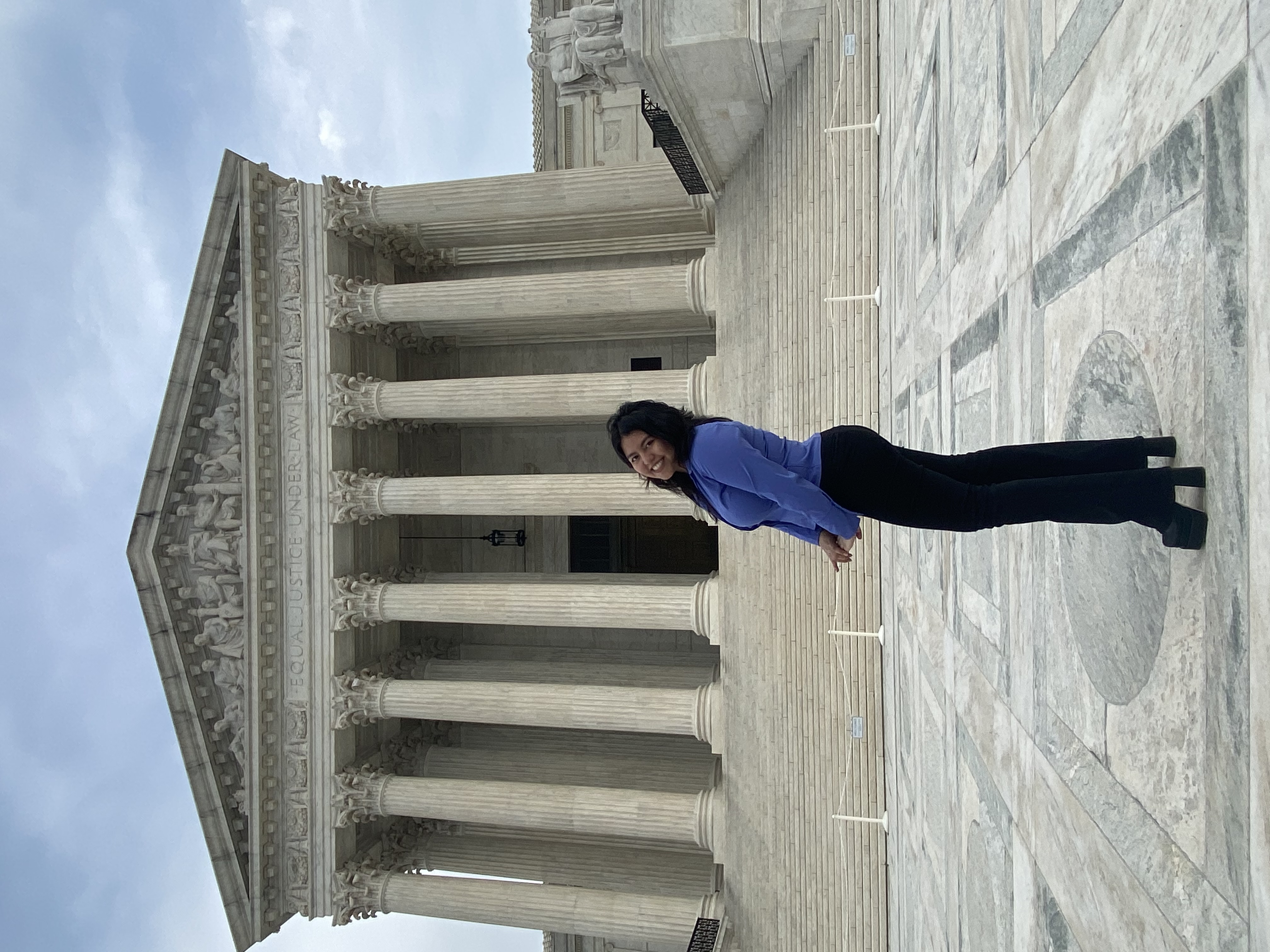 Photo of Diana Alfaro in front of the U.S. Supreme Court Building