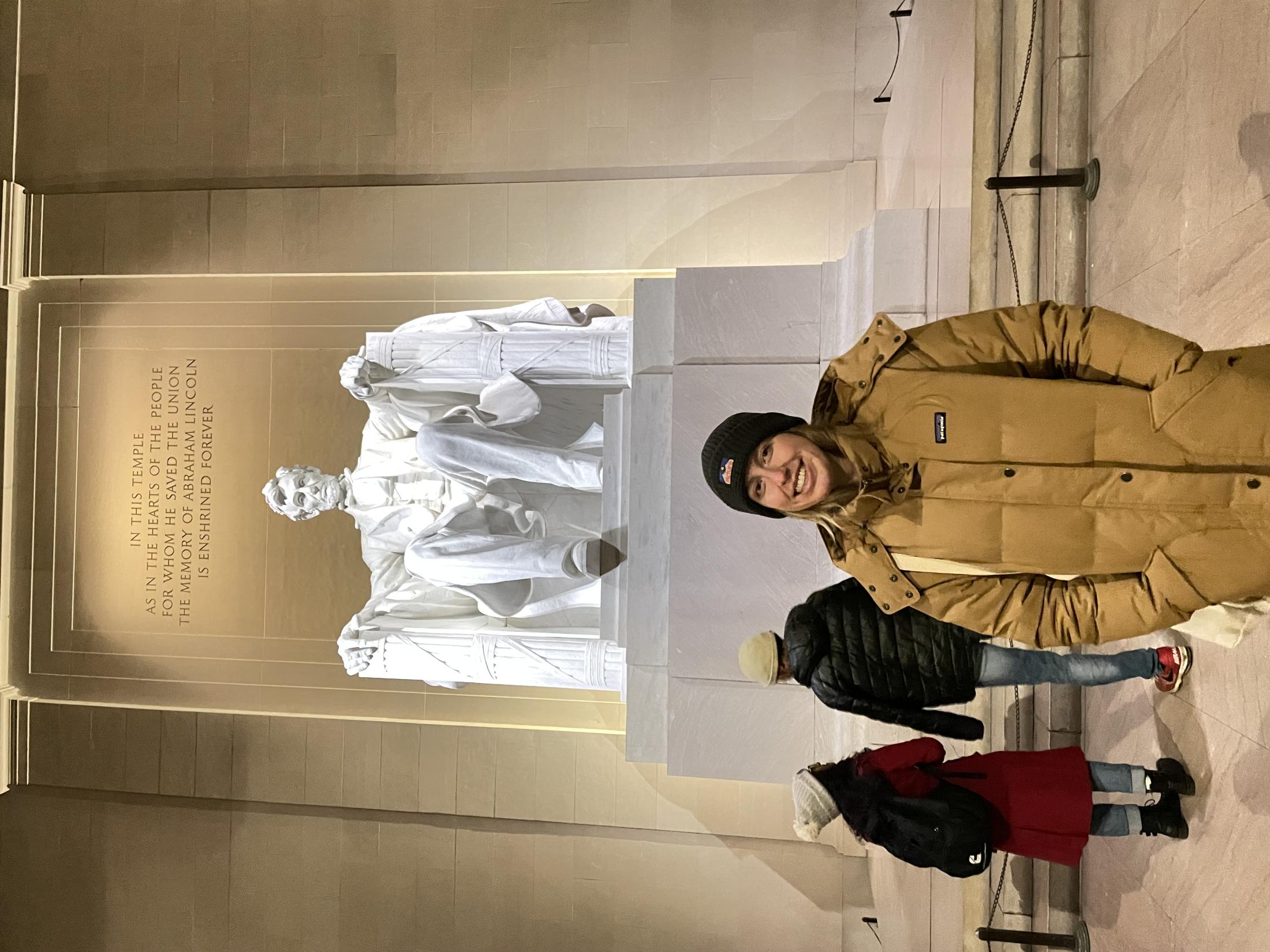 Photo of student in front of the Lincoln Memorial