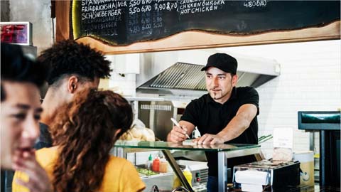 Worker taking food orders
