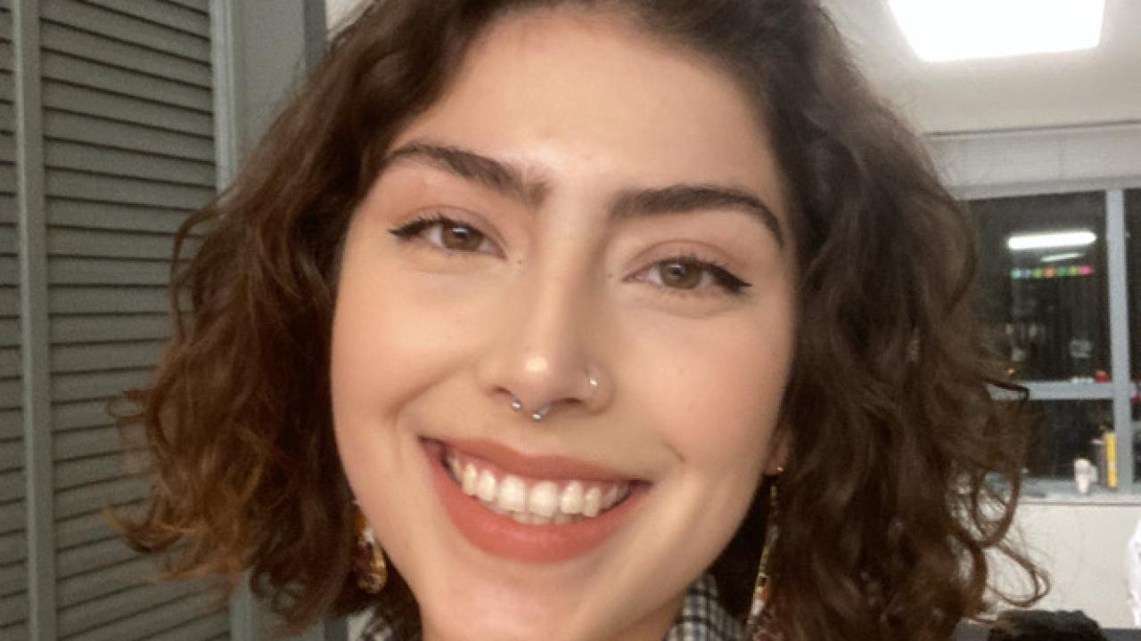 Headshot of Liliana smiling at the camera