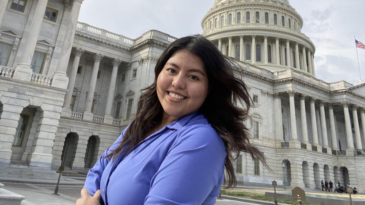 Up close photo of Diana Alfaro standing in front of the Capitol