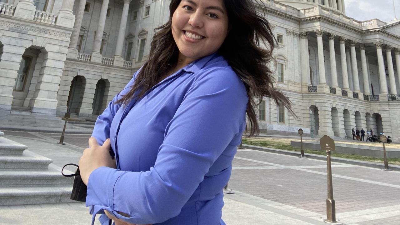 Up close photo of Diana Alfaro standing in front of the Capitol