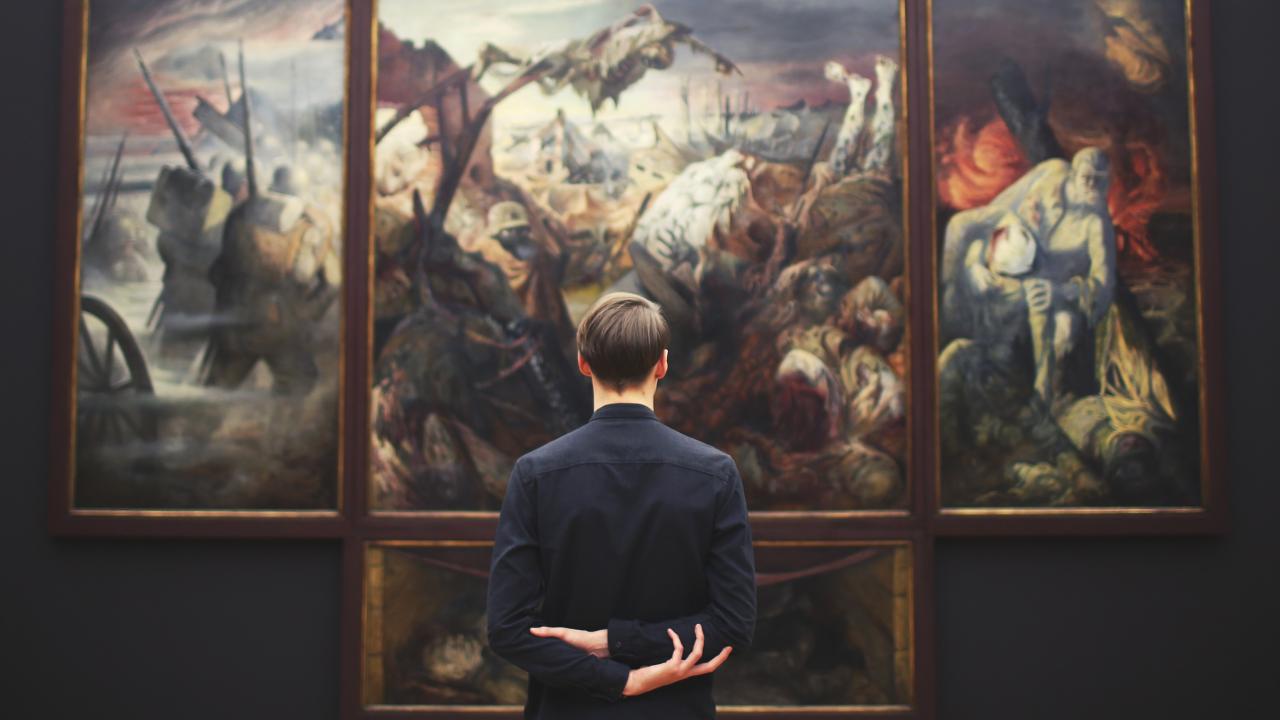 guy looking at image in museum